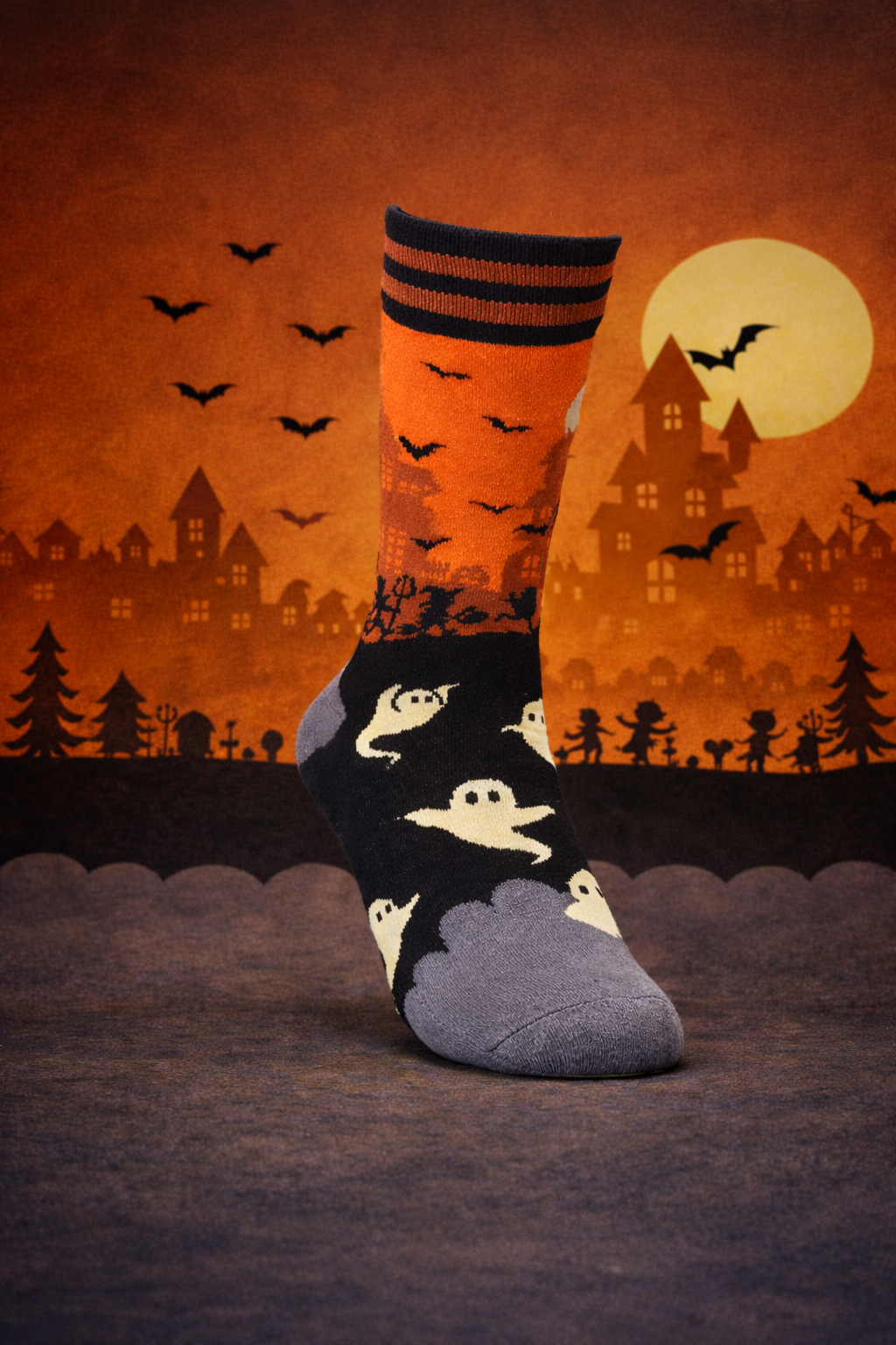The Other Side Halloween sock standing in a spotlight in front of a haunted town under a full moon